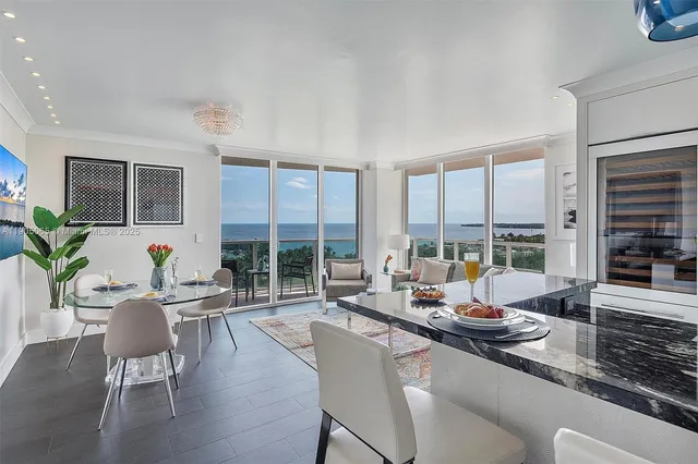 a kitchen with cabinets appliances a sink and a counter top space