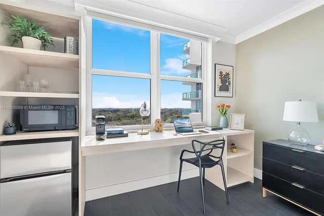 a kitchen with stainless steel appliances granite countertop a sink and a stove