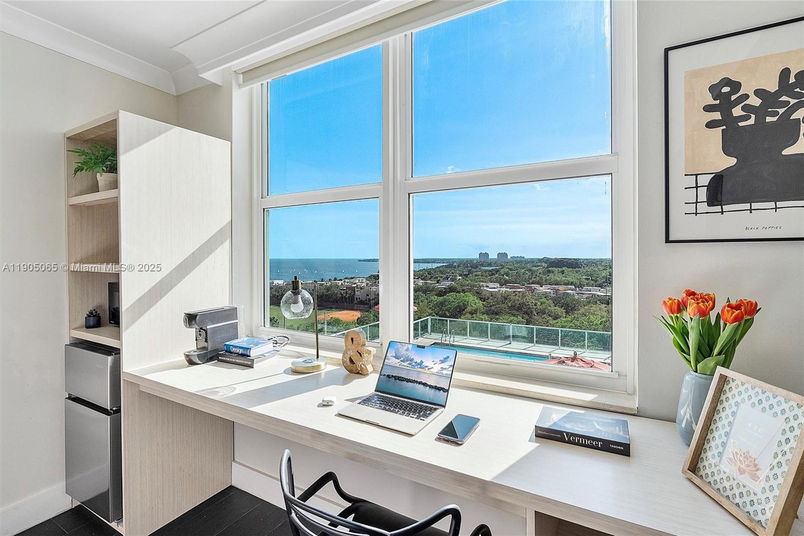 2889 McFarlane Road, Unit 902 Miami, FL 33133 - Photo 22 of 62 a view of a workspace with furniture and a window