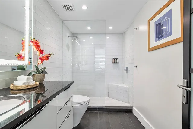 a bedroom with a bed and a fireplace