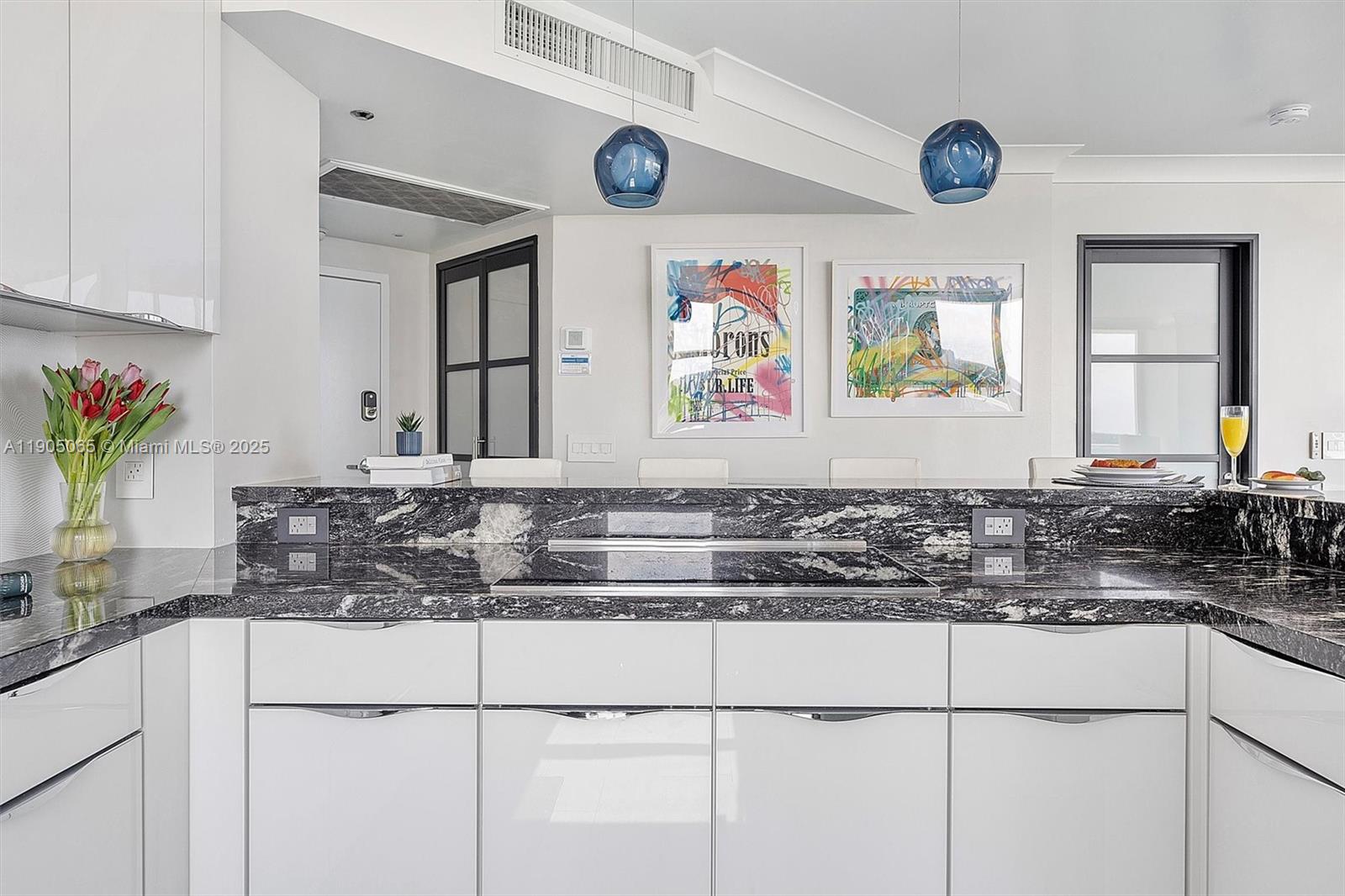 2889 McFarlane Road, Unit 902 Miami, FL 33133 - Photo 39 of 62 a bathroom with a sink and a mirror