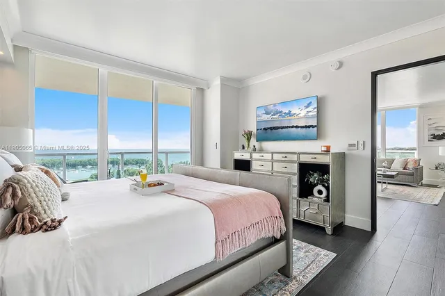 a bathroom with a granite countertop sink toilet a mirror and shower