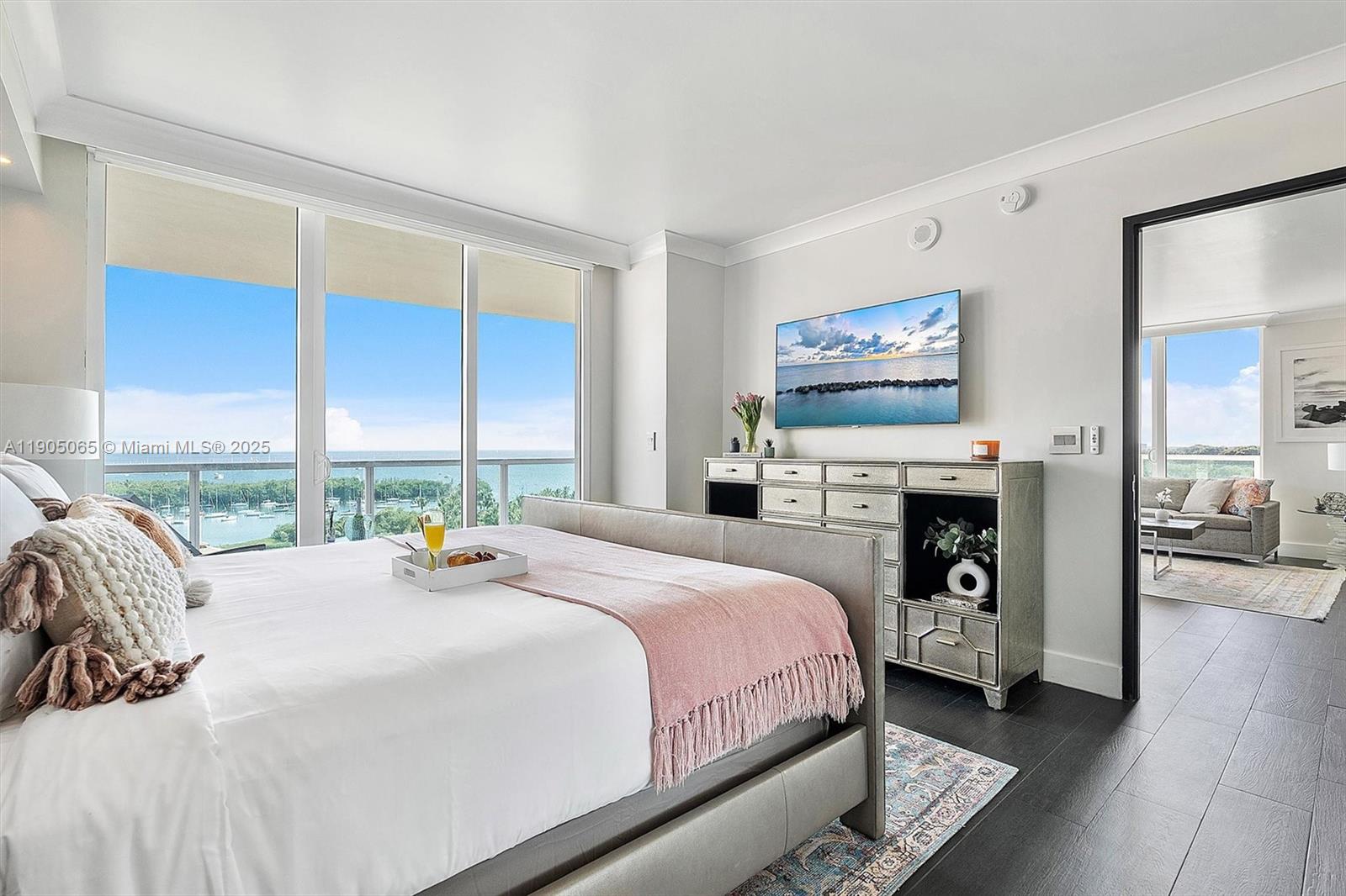 2889 McFarlane Road, Unit 902 Miami, FL 33133 - Photo 41 of 62 a bedroom with a bed and a fireplace