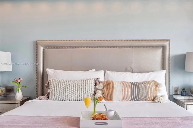 a living room with furniture and floor to ceiling window