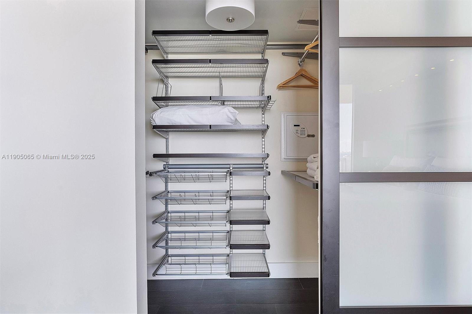 2889 McFarlane Road, Unit 902 Miami, FL 33133 - Photo 46 of 62 a view of a room with racks on the wall