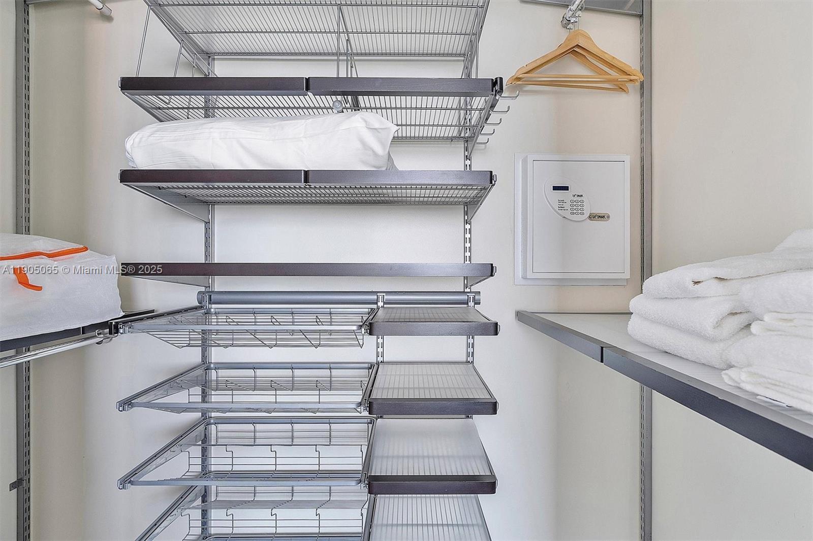 2889 McFarlane Road, Unit 902 Miami, FL 33133 - Photo 47 of 62 a view of a room with rack on the wall