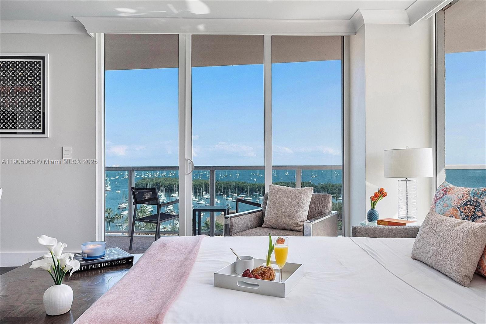 2889 McFarlane Road, Unit 902 Miami, FL 33133 - Photo 52 of 62 a living room with furniture and floor to ceiling window