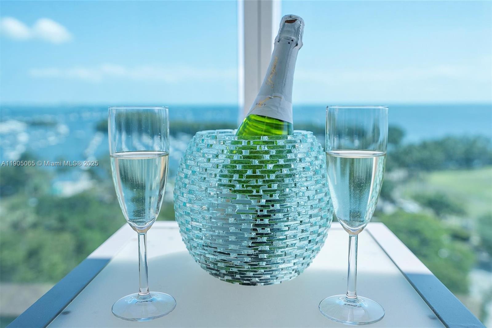 2889 McFarlane Road, Unit 902 Miami, FL 33133 - Photo 60 of 62 a vase of flowers sitting on a table