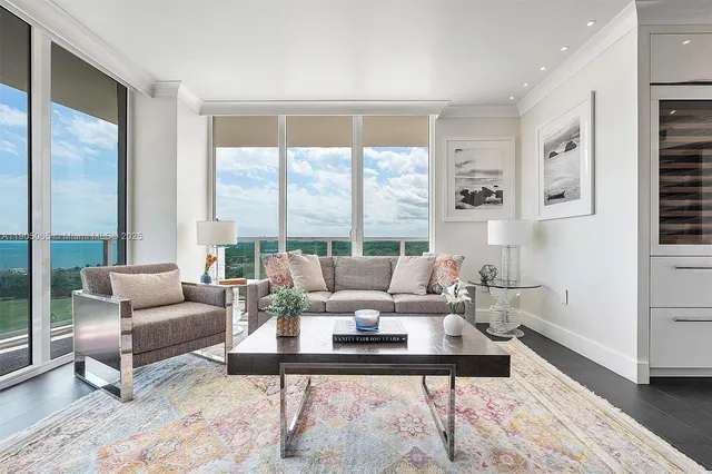 a dining room with wooden floor and large window