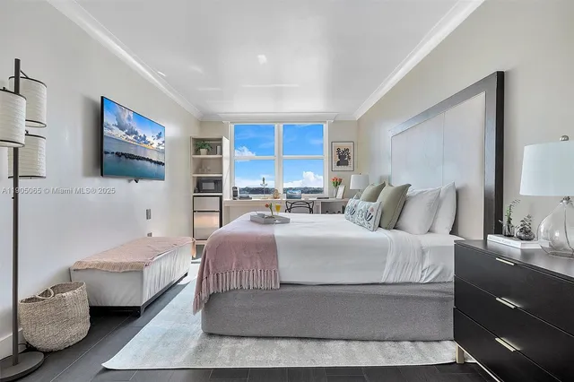 a living room with furniture and a floor to ceiling window