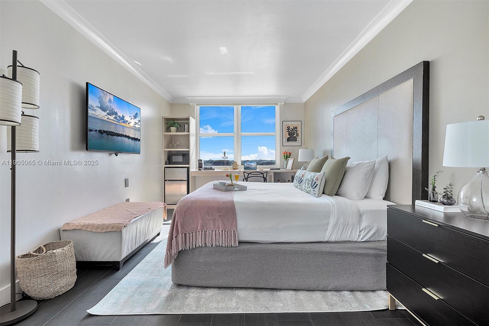 2889 McFarlane Road, Unit 902 Miami, FL 33133 - Photo 8 of 62 a bedroom with a large bed and a couch