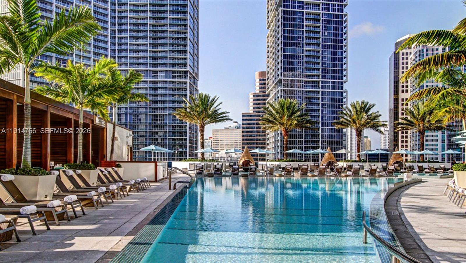 200 Biscayne Blvd Way, Unit 4408 Miami, FL 33131 - Photo 27 of 36 a patio with water view and outdoor seating
