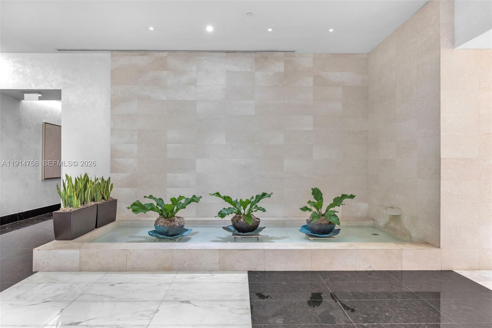 200 Biscayne Blvd Way, Unit 4408 Miami, FL 33131 - Photo 34 of 36 a white vase with flowers sitting on a table