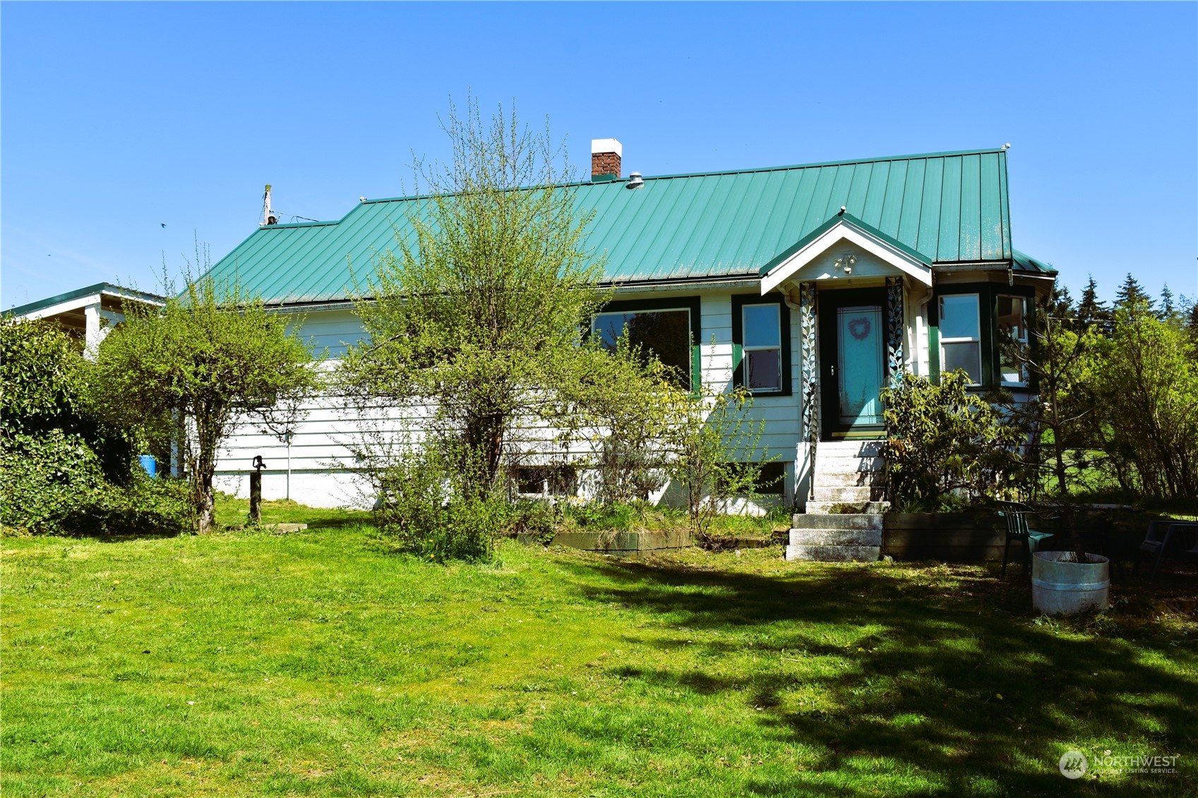 3370 Sweet Road Blaine, WA 98230 - Photo 1 of 20 a front view of a house with garden