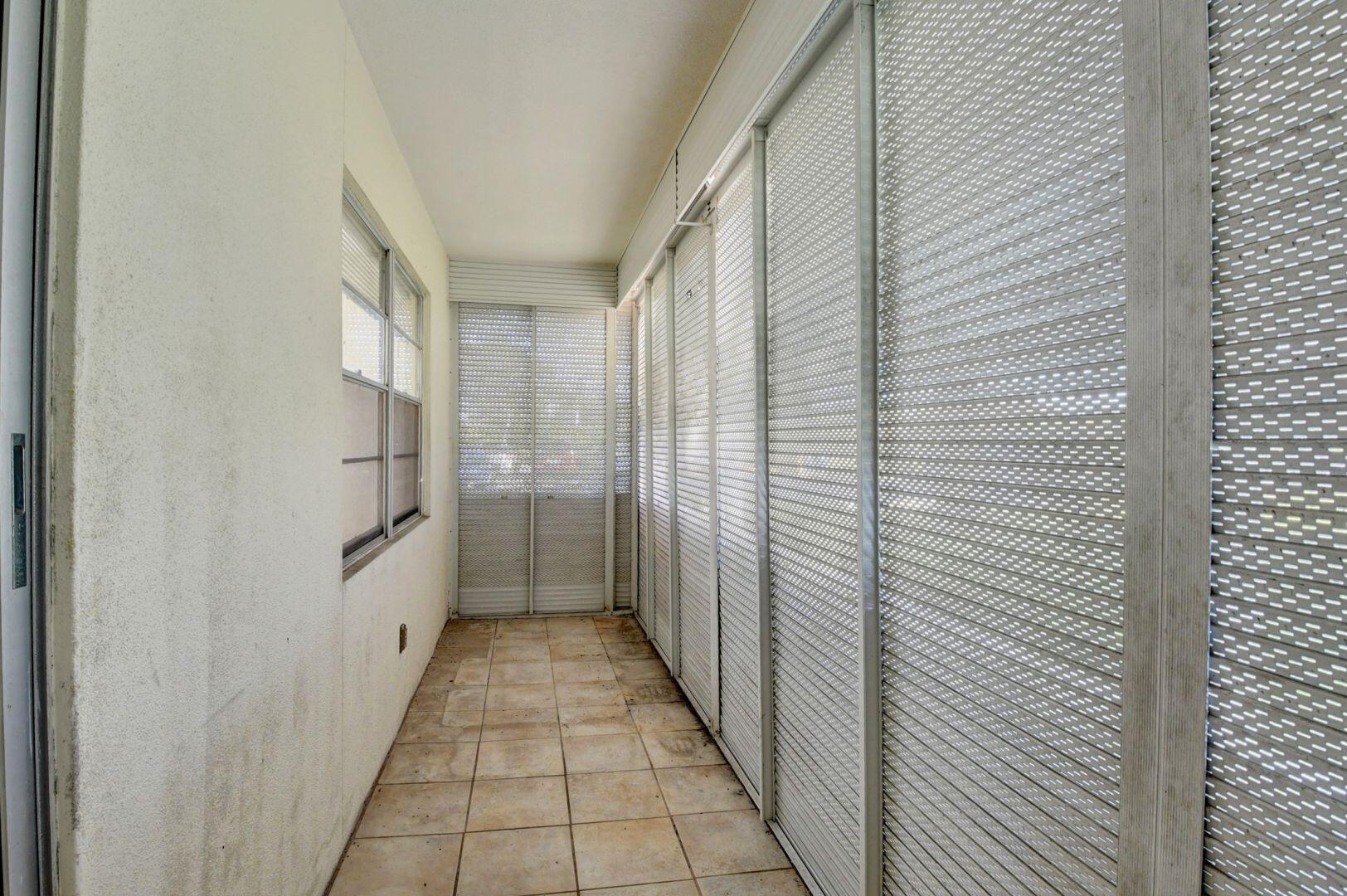 505 Mansfield M Boca Raton, FL 33434 - Photo 19 of 43 Screened Patio w/Pull Downs