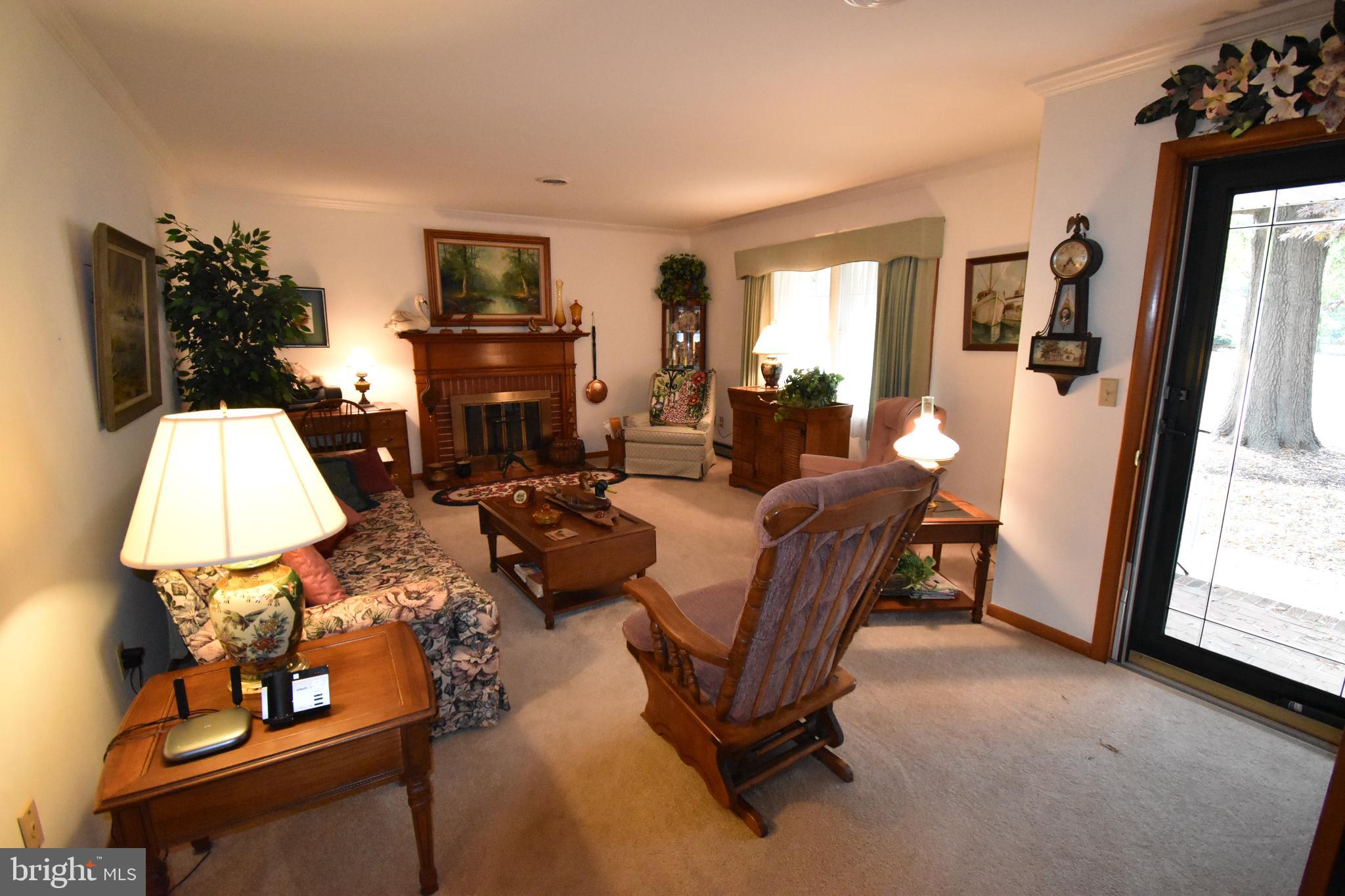 4 Shawnee Road Cambridge, MD 21613 - Photo 3 of 21 Living Room with wood burning fireplace