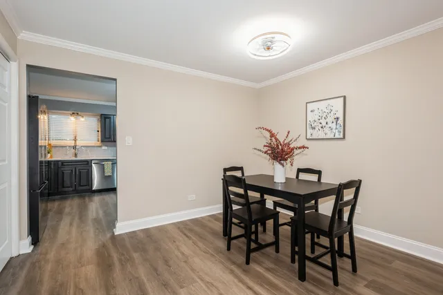 a view of a room with furniture and wooden floor