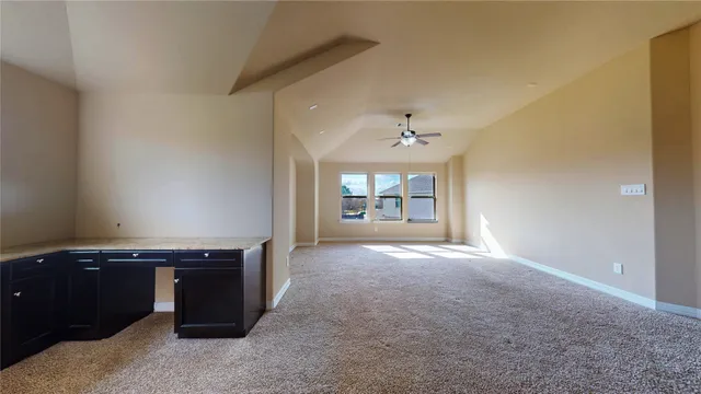 a view of empty room with windows