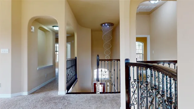 a view of a livingroom with a ceiling fan and window