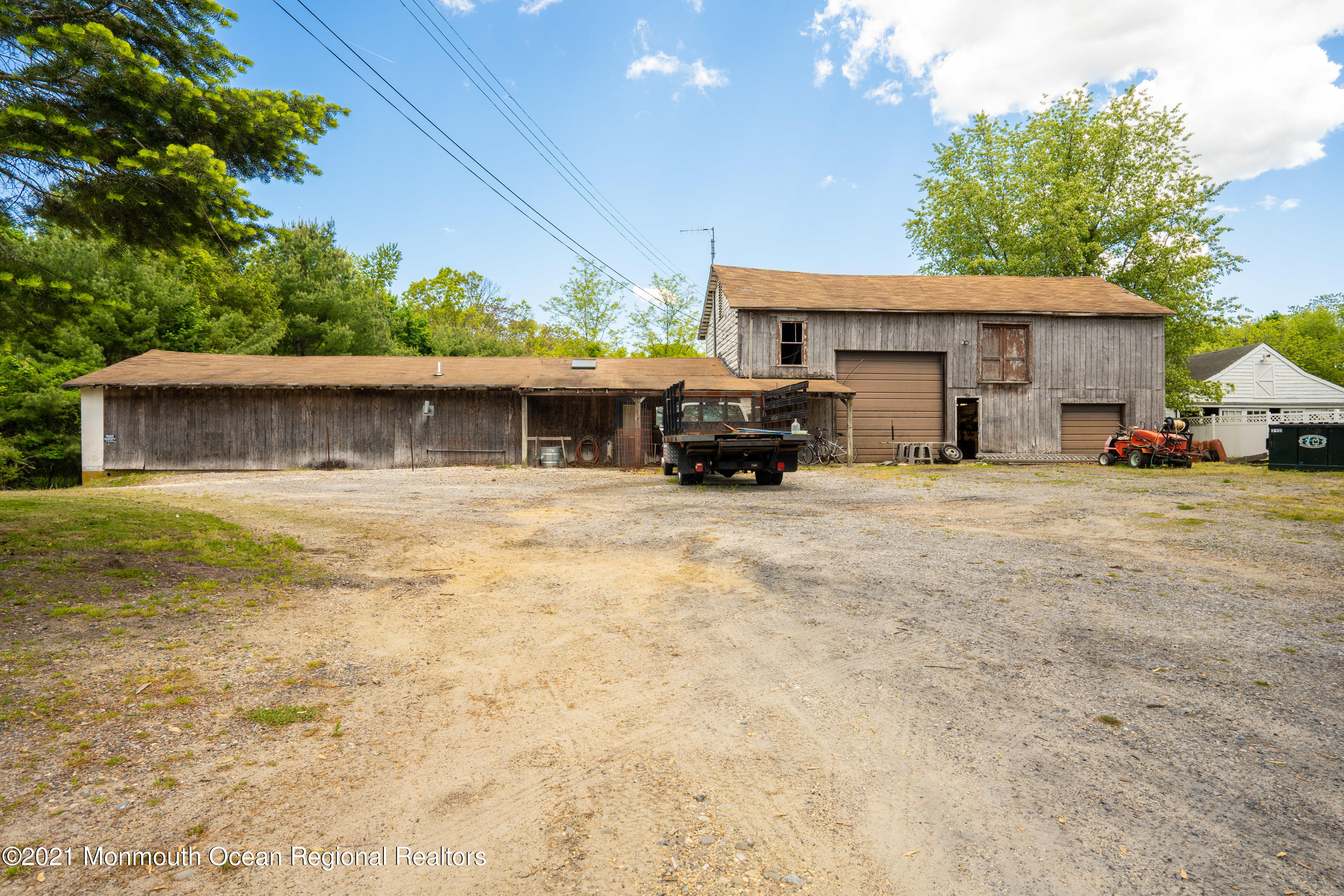 198 Adelphia Road Farmingdale, NJ 07727 - Photo 13 of 28 a view of a house with large space and a car park in front of it