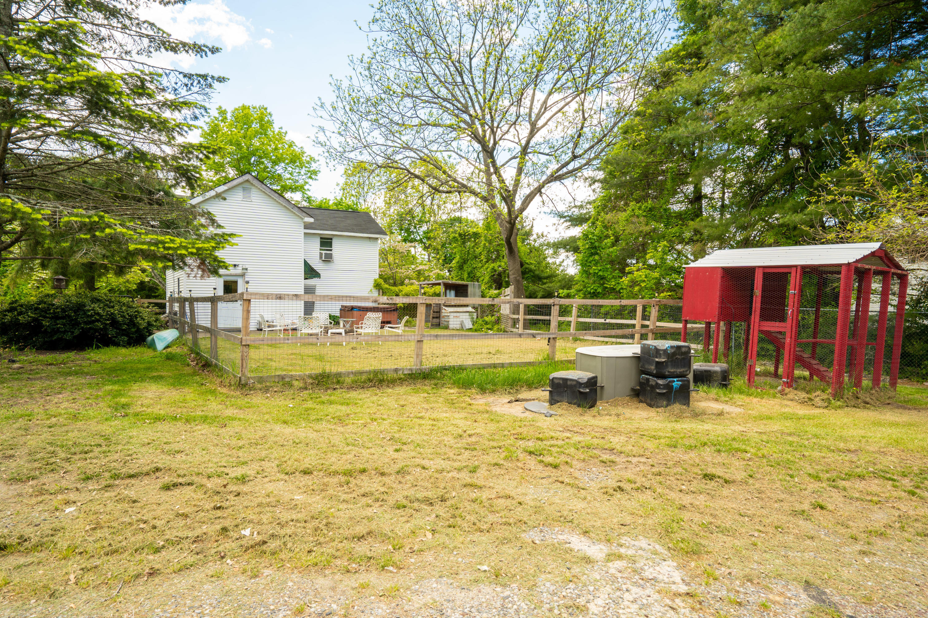 198 Adelphia Road Farmingdale, NJ 07727 - Photo 17 of 28 a view of swimming pool with seating area and trees in the background