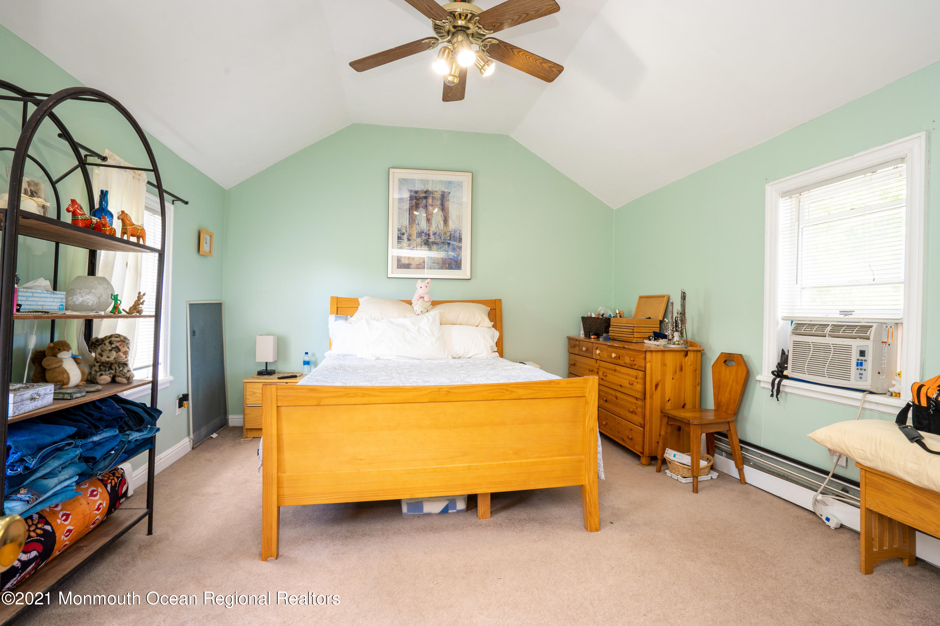 198 Adelphia Road Farmingdale, NJ 07727 - Photo 24 of 28 a bedroom with a bed and a chandelier