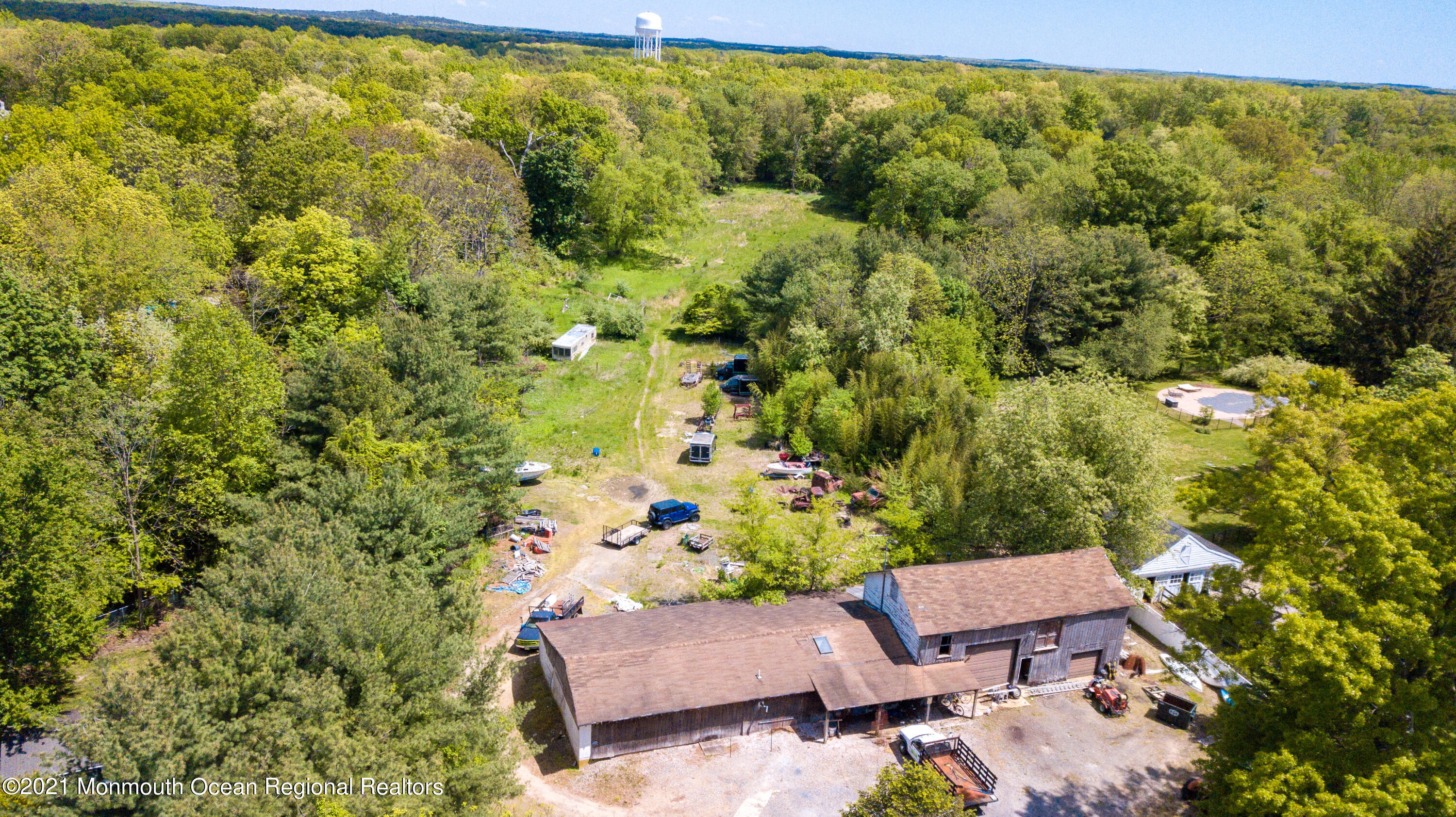 198 Adelphia Road Farmingdale, NJ 07727 - Photo 6 of 28 a backyard of a house with table and chairs