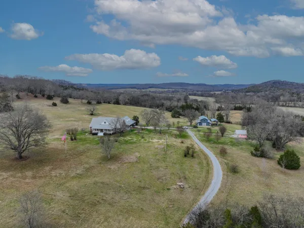 an aerial view of a houses with outdoor space