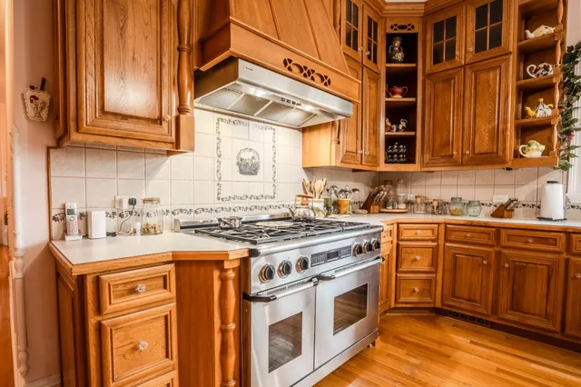 a view of an entryway with granite countertop wooden cabinets