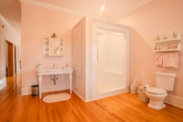 a bedroom with a bed and dresser