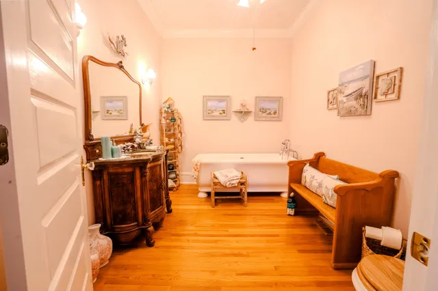 a bed room with a bed and a chair