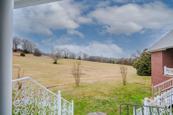 a view of a backyard with green space