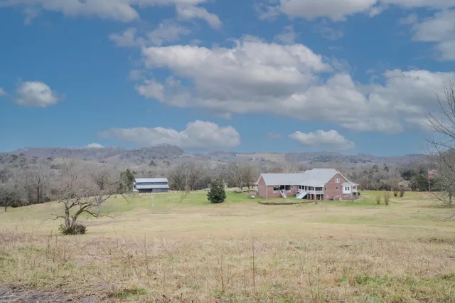 a room with furniture a flat screen tv and a window