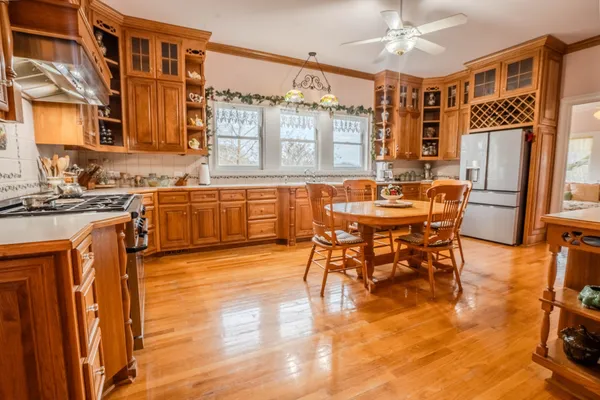 a kitchen with stainless steel appliances granite countertop a stove and a sink