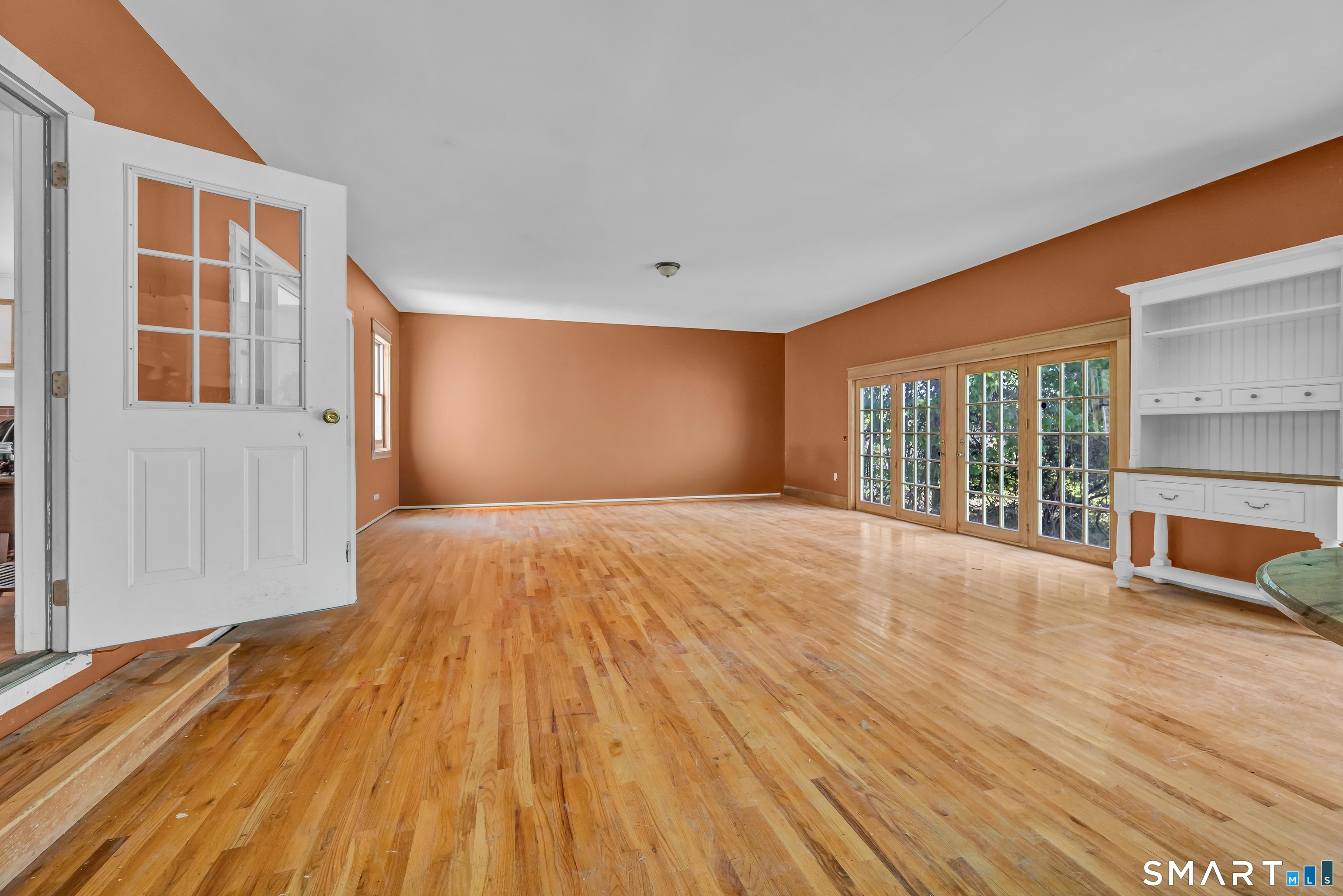 30 Whisconier Road Brookfield, CT 06804 - Photo 14 of 39 a view of an empty room with wooden floor and a window