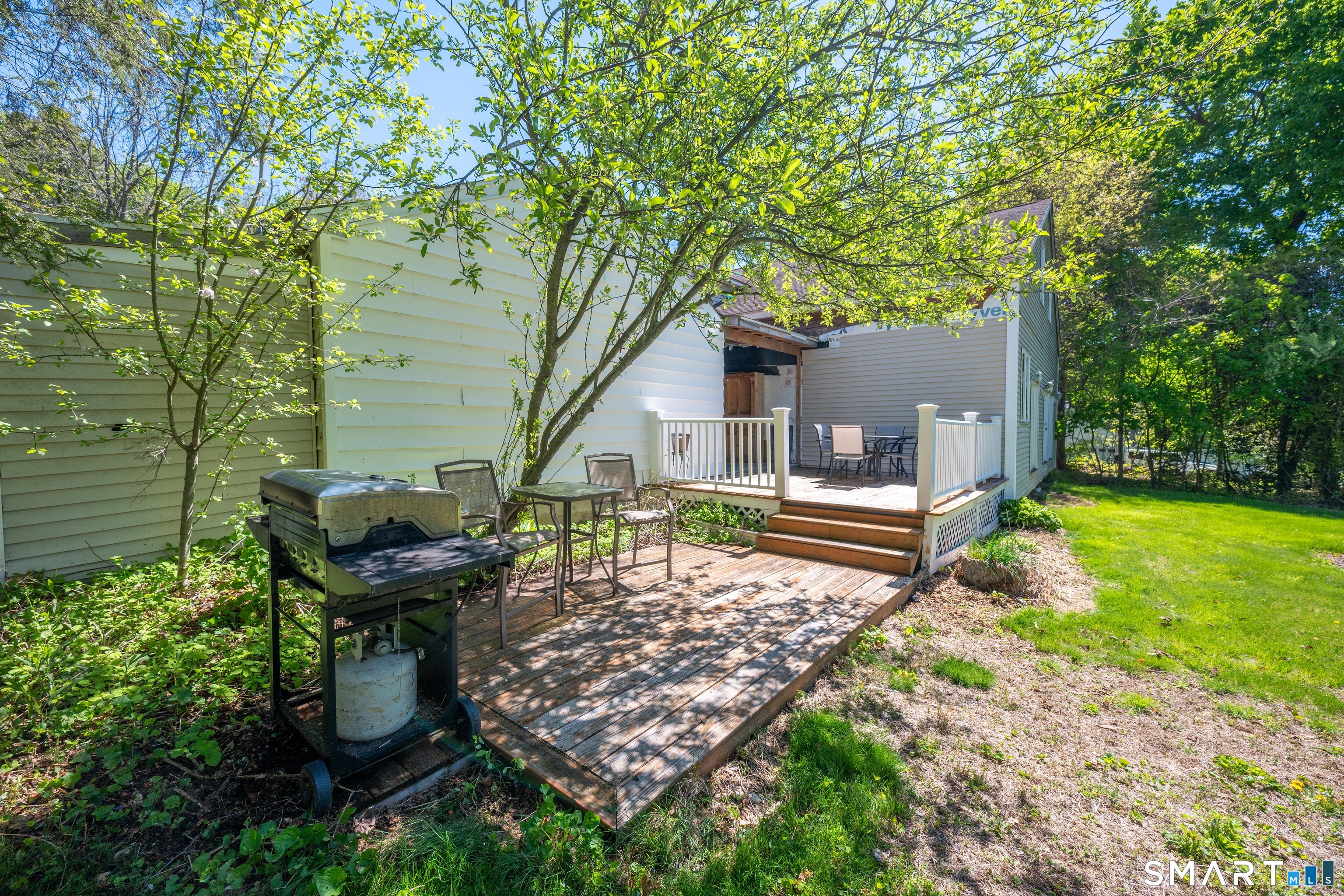 30 Whisconier Road Brookfield, CT 06804 - Photo 33 of 39 a backyard of a house with table and chairs
