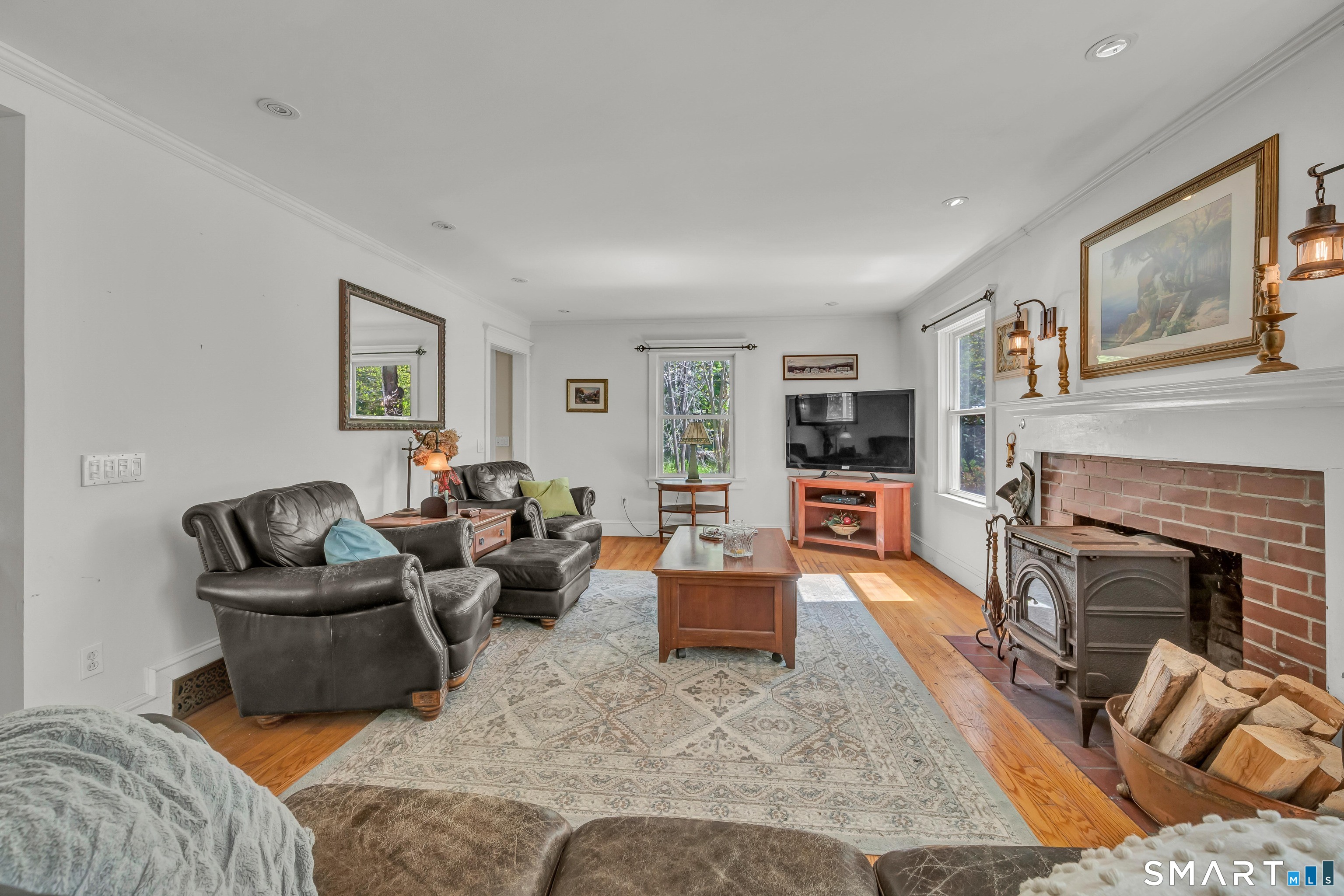 30 Whisconier Road Brookfield, CT 06804 - Photo 6 of 39 a living room with furniture and a fireplace