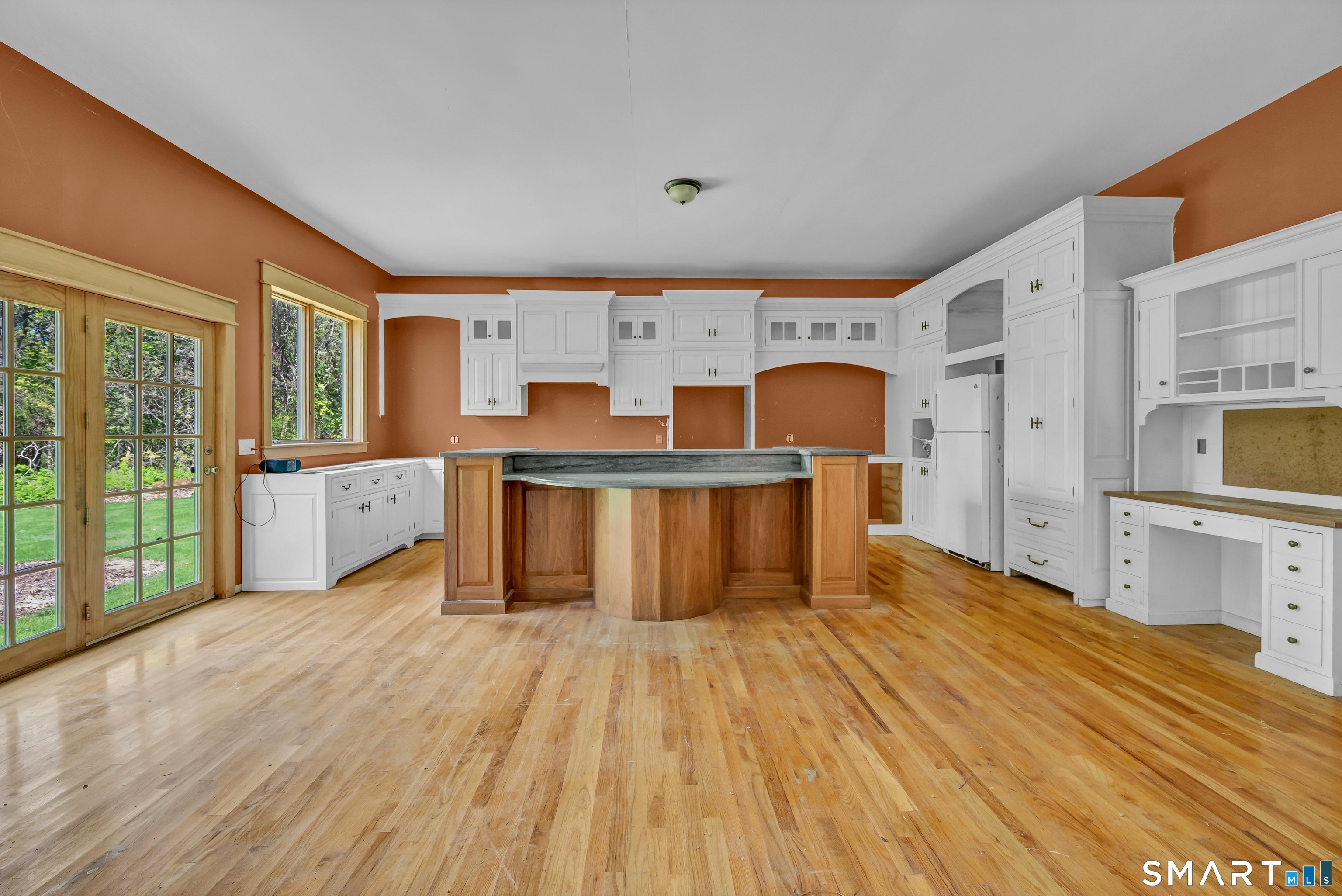 30 Whisconier Road Brookfield, CT 06804 - Photo 9 of 39 a large kitchen with stainless steel appliances a large window a oven and cabinets