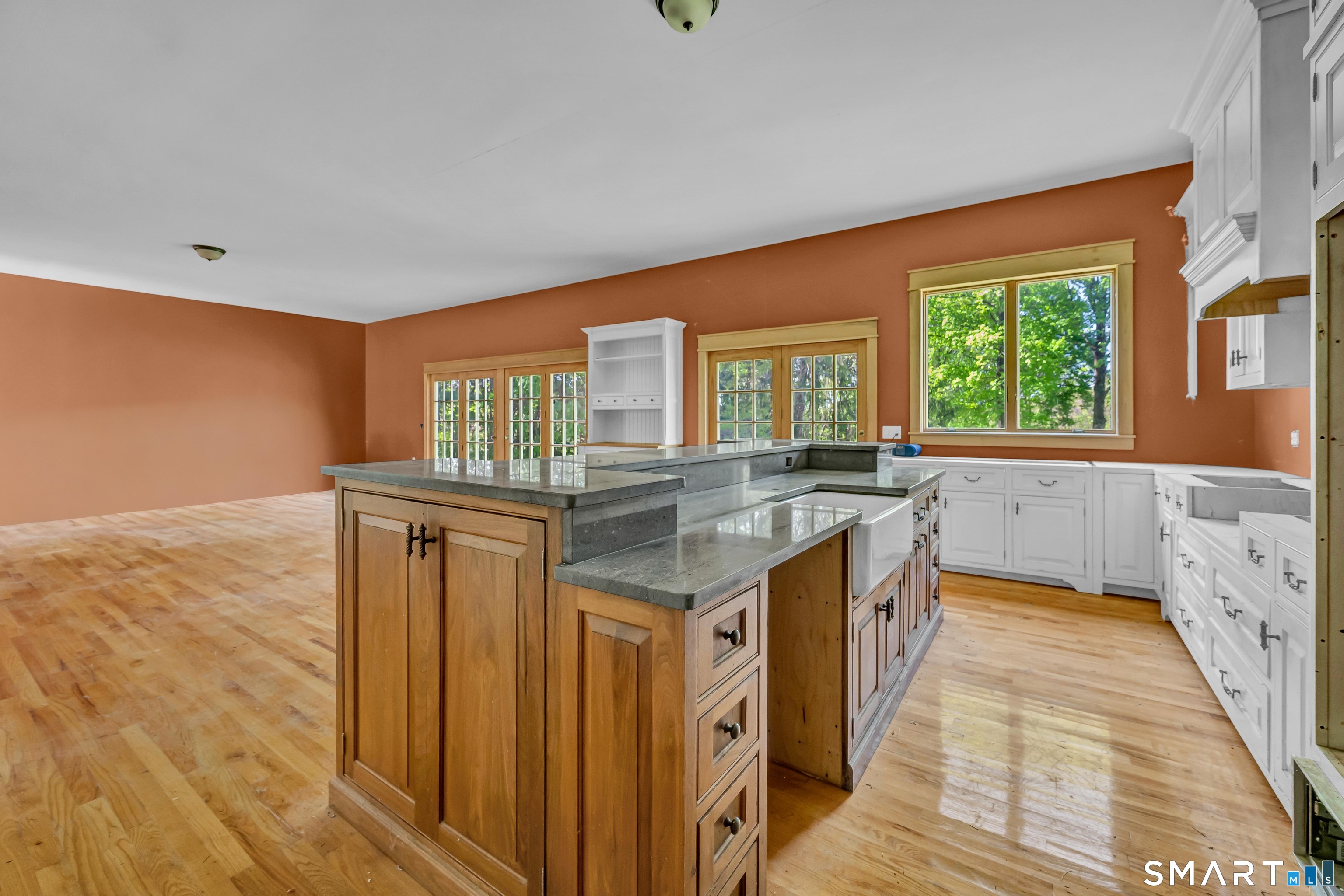 30 Whisconier Road Brookfield, CT 06804 - Photo 10 of 39 a kitchen with granite countertop a sink and a wooden floor