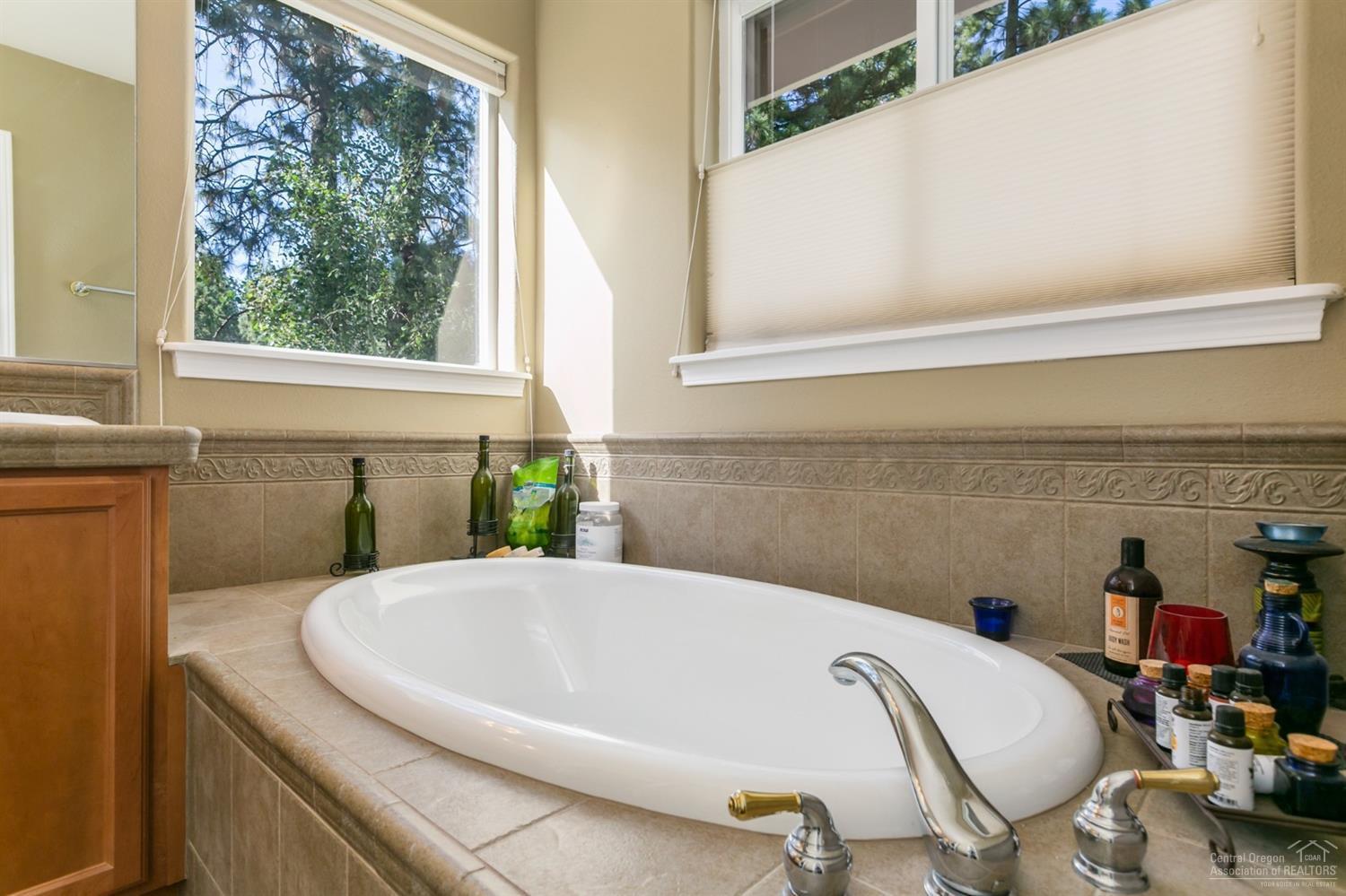 19582 Brookside Way Bend, OR 97702 - Photo 10 of 10 Soaking tub in sunlit master bathrooms.
