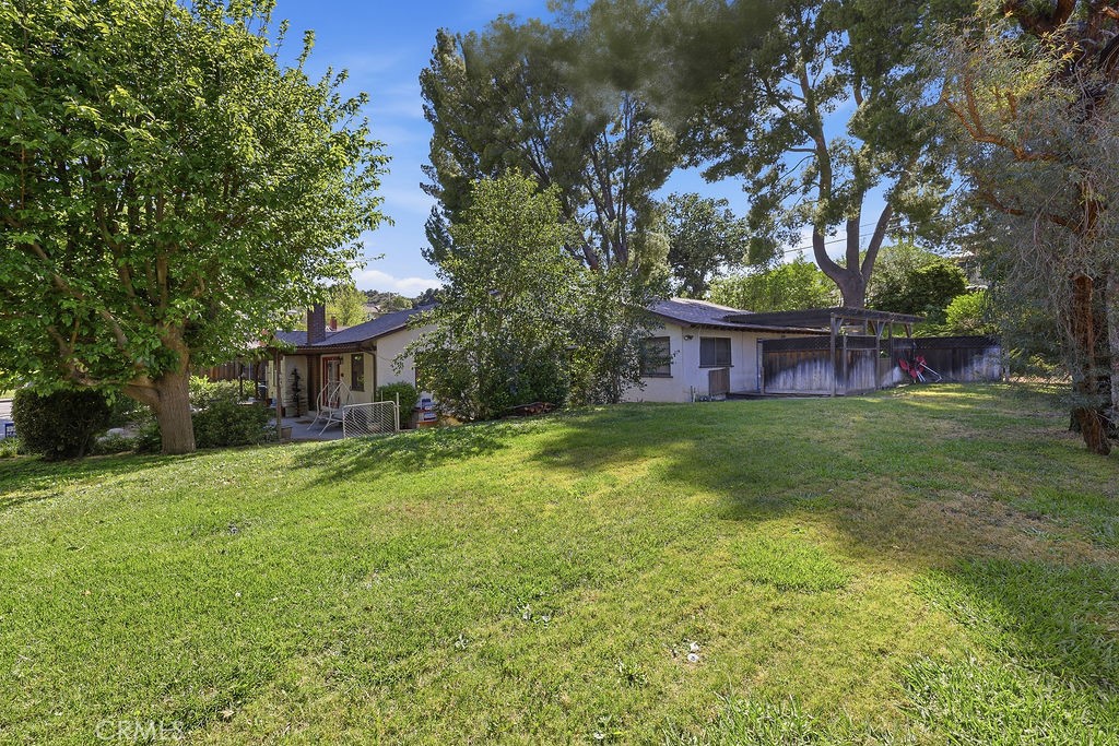 25102 Wheeler Road Newhall, CA 91321 - Photo 5 of 9 a front view of a house with yard and green space