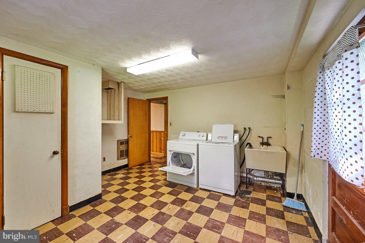 4912 Sharon Road Temple Hills, MD 20748 - Photo 20 of 25 Basement Laundry room with laundry shoot