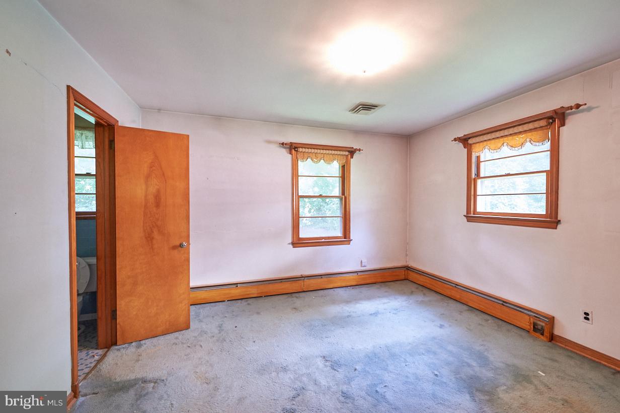 4912 Sharon Road Temple Hills, MD 20748 - Photo 10 of 25 Bedroom with private bathroom