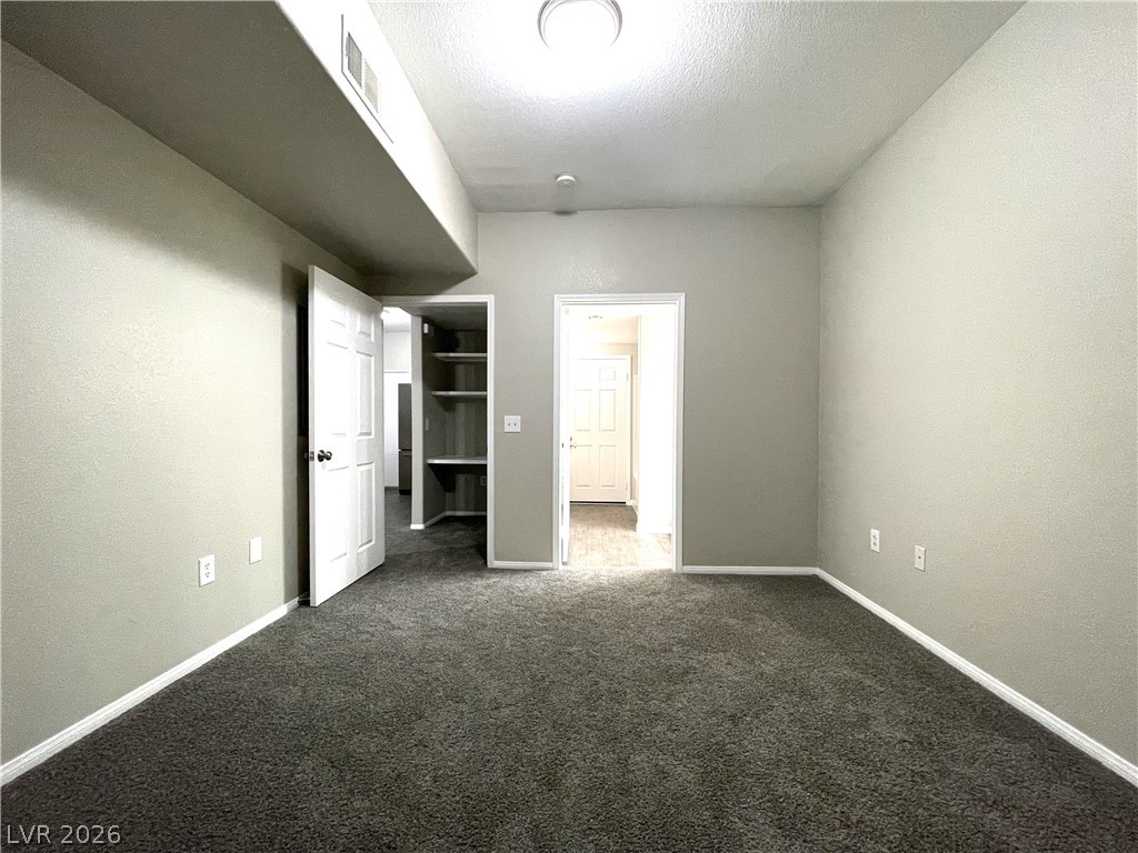 10001 Peace Way, Unit 1327 Las Vegas, NV 89147 - Photo 15 of 21 An inviting room features freshly installed carpeting and newly painted walls.