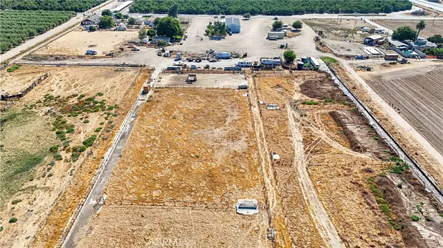 an aerial view of a houses with outdoor space