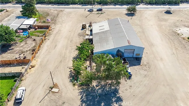 a view of a house with wooden fence