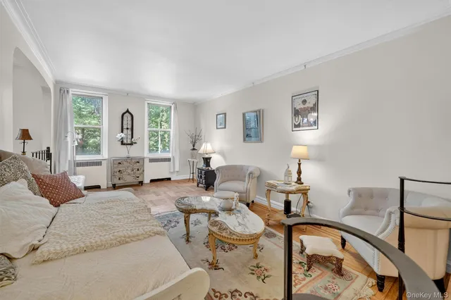 a living room with furniture and large window