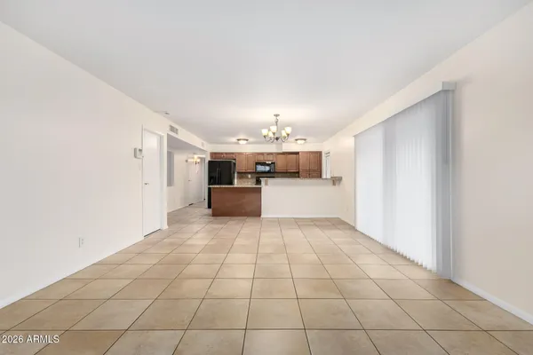 a view of a kitchen with windows and furniture