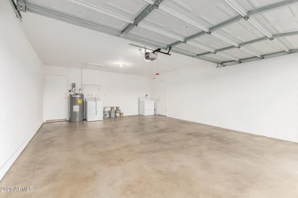 a bathroom with a toilet a sink a mirror a bathtub and shower