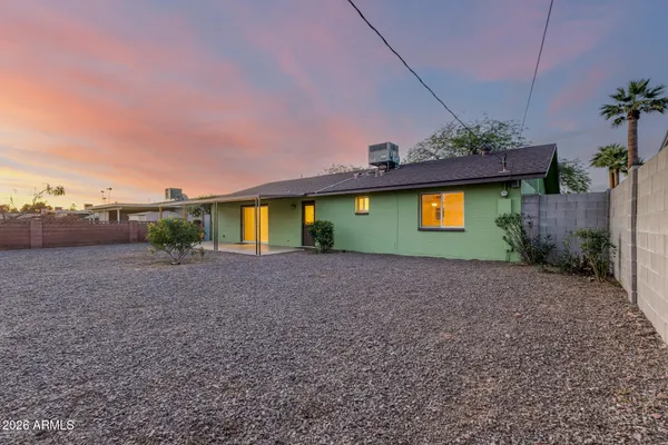a view of a backyard of the house